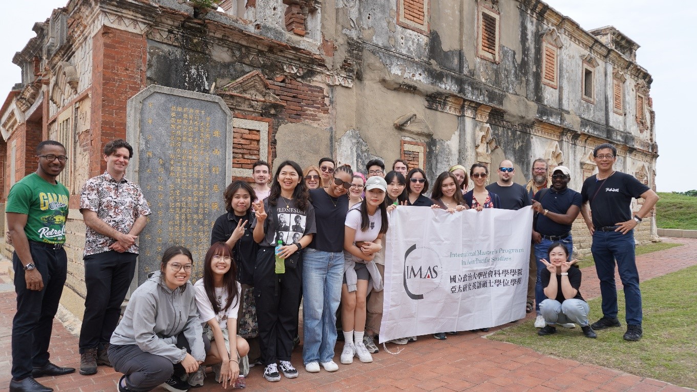 IMAS students and scholars in front of a bullet-riddled former PLA command post from the 1949 Kinmen landing 